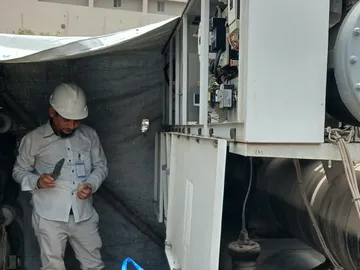 Technician servicing a water-cooled chiller
