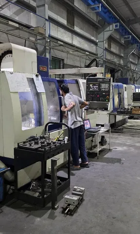 Machinist operating a CNC machine