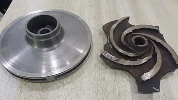 New impeller beside the worn original sample