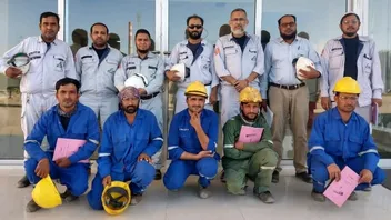 HSE training in Pakistan: participants holding their course folders